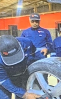 Allied Autotech technicians working on a vehicle wheel